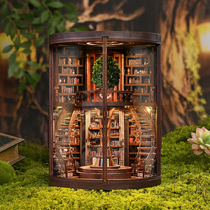 Enchanted Library DIY Book Nook Kit – circular grand library with LED lighting and double-door opening, front view on moss background