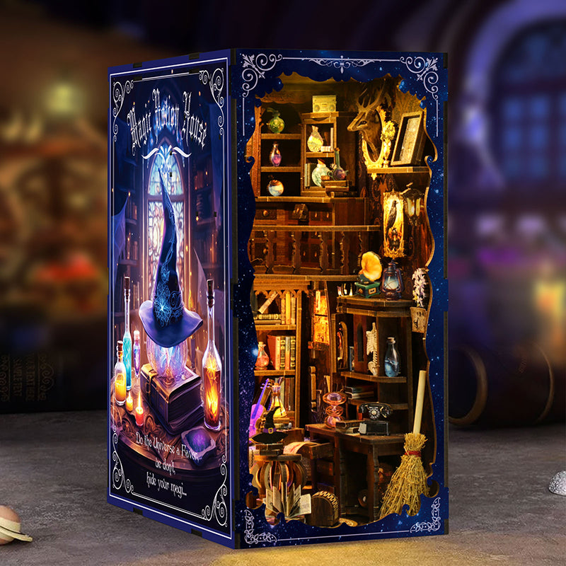 Magic Potion House book nook displayed between real books showing full starry blue side panel and warm LED interior glow
