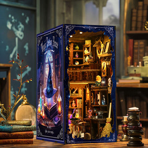 Magic Potion House book nook side angle view showing starry night blue panel and warm LED glow on a wooden desk