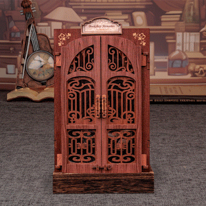 Bookshop Memories book nook kit animated GIF showing warm LED light turning on