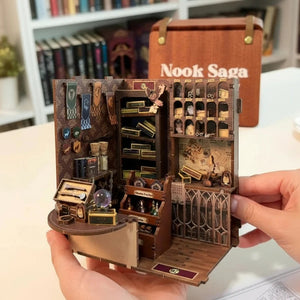 Hands holding the interior section of the Nook Saga Magic Wand Shop kit, showing the display shelves.