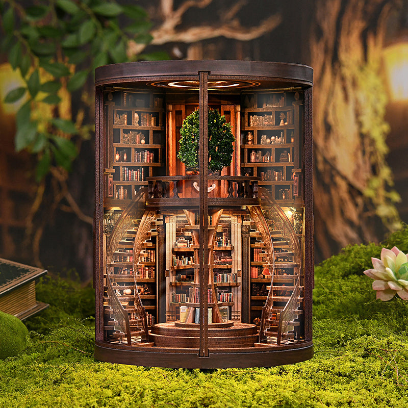 Enchanted Library DIY Book Nook Kit – circular grand library with LED lighting and double-door opening, front view on moss background