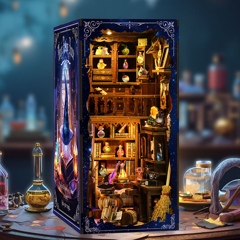 Magic Potion House book nook kit fully assembled with warm LED lighting glowing inside miniature witch apothecary shelves