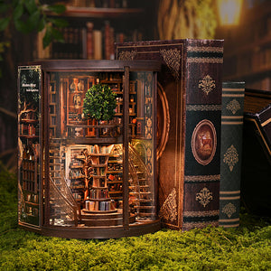 Enchanted Library DIY book nook side-open view between decorative books, showcasing spiral staircase and miniature topiary tree