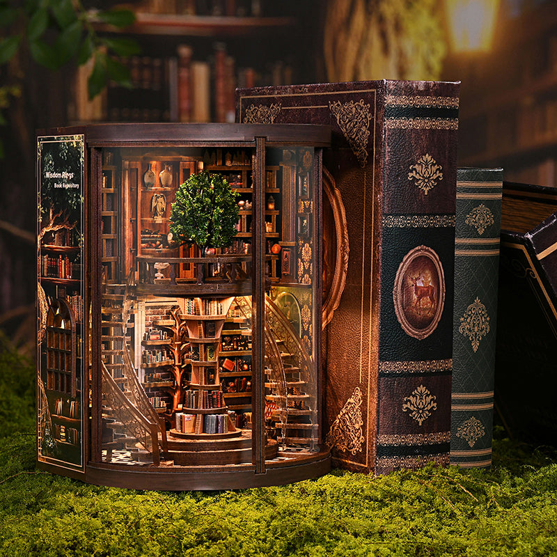 Enchanted Library DIY book nook side-open view between decorative books, showcasing spiral staircase and miniature topiary tree