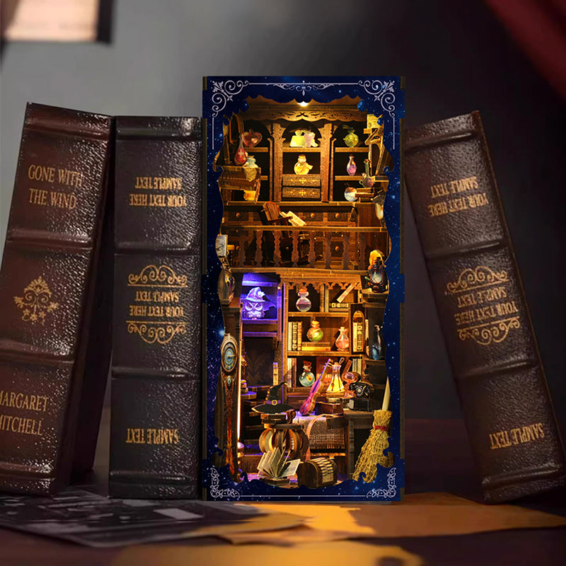 Magic Potion House miniature kit front view showing full interior with potion bottles broom and witch hat details lit up