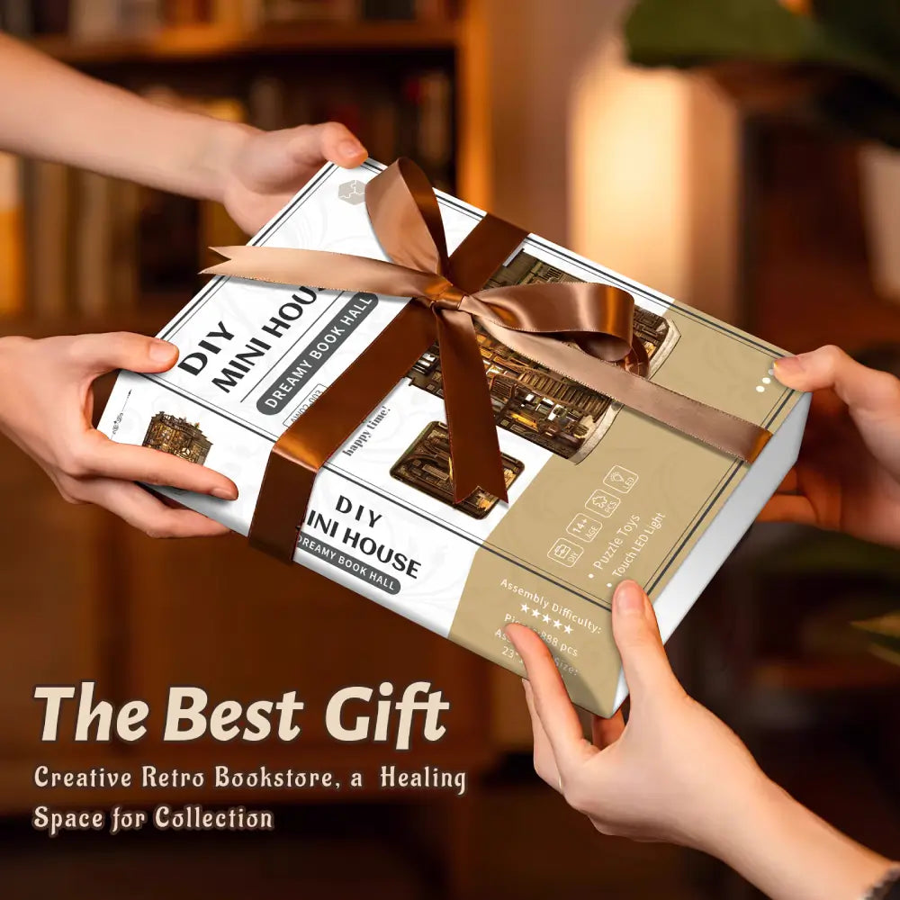 Elegant white and gold gift box for the NookSaga Dreamy Book Hall DIY miniature house kit.