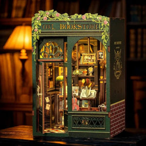 Close-up of the Owl Bookstore interior showing warm LED light, miniature globe, reading desk, and detailed props.