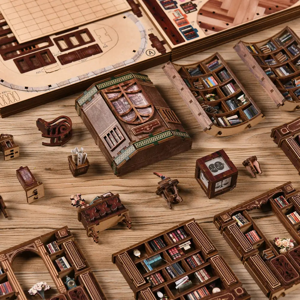 Various miniature wooden furniture pieces and bookshelves from the NookSaga Dreamy Book Hall kit.